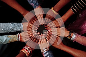 Hands of happy group of African people which stay together in circle happy