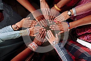 Hands of happy group of African people which stay together in circle happy