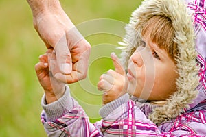 Hands Happy parents and child outdoors in the park