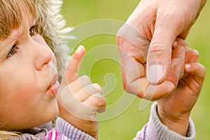 Hands Happy parents and child outdoors in the park