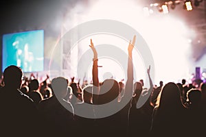 hands of happy people crowd having fun at stage at summer live rock fest