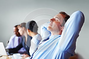 Hands, head and business man relax in office or chair to finish work, project and productivity. Corporate worker, team