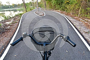 Hands and heads of bicycles coming to a crossroads and having to choose which way