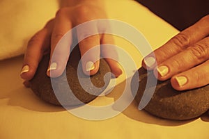 hands on healing stones in spa and relaxation