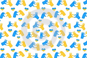 Hands in heart form in Ukraine flag color