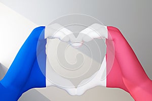 hands in heart gesture painted in flag France