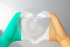 hands in heart gesture painted in flag Ireland