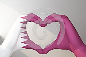 hands in heart gesture painted in flag Qatar