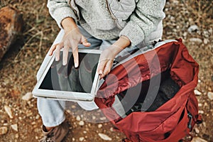 Hands, hiking and a person with a tablet in nature for gps location, search or online for travel. Above, internet and a