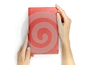 Hands hold blank red hardcover book on white