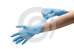 Hands hold a disposable protective mask on a white background