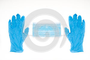 Hands hold a disposable protective mask on a white background