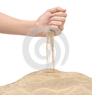Hands hold sand to sprinkle. Sand runs through hand like the times goes by