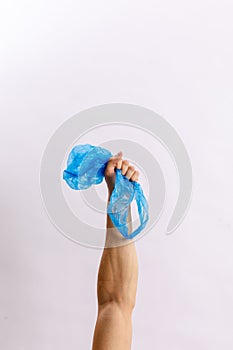 Hands hold trash on a light background. The concept of separate trash, stop plastic, recycling