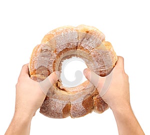 Hands hold white kalatch