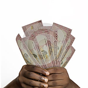 hands holding 5000 Rwandan franc notes. closeup of Hands holding Rwandan currency notes