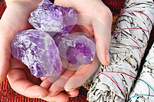 Hands Holding Amethyst Crystals