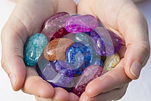 Hands holding beautiful crackle quartz