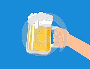 Hands holding a beer mug isolated on blue background