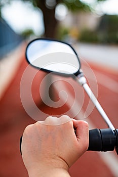 Hands holding bicycle handle