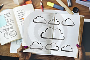 Hands holding a book cloud icons