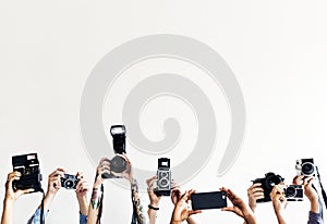 Hands are holding cameras with white background