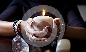 Hands holding a candle