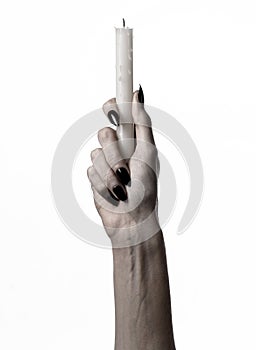 Hands holding a candle, a candle is lit, white background, solitude, warmth, in the dark, Hands death, hands witch