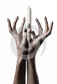 Hands holding a candle, a candle is lit, white background, solitude, warmth, in the dark, Hands death, hands witch