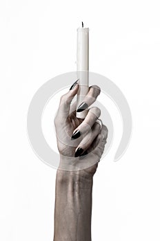 Hands holding a candle, a candle is lit, white background, solitude, warmth, in the dark, Hands death, hands witch