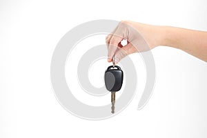 Hands holding car keys on a white background. Isolated background