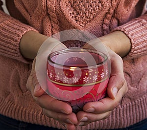 Hands Holding Christmas Scent Candle