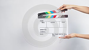 Hands is holding Clapper board or movie slate. it is used in video production and film industry on white background