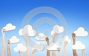 Hands holding cloud shaped speech bubbles Concept