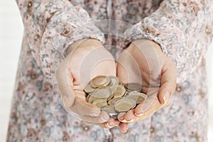 Hands holding coins money