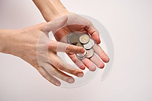 Hands holding coins money on white background