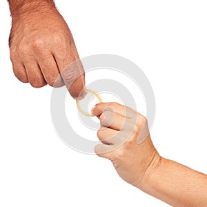 Hands holding a condom isolated on white