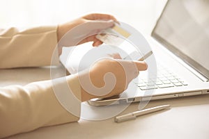 Hands holding credit card and smatrphone. Onine shopping. Business, remote work, always connect, online banking concept.