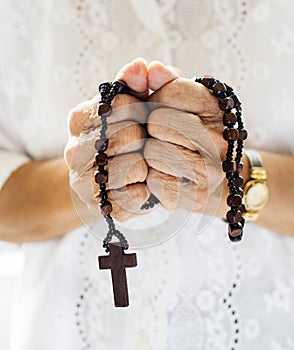 Hands holding cross prayer faith in christianity religion