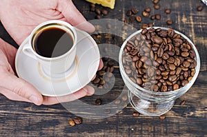 Hands holding a cup of coffee