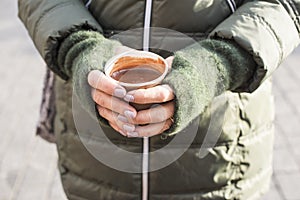 Hands holding cup of hot chocolate