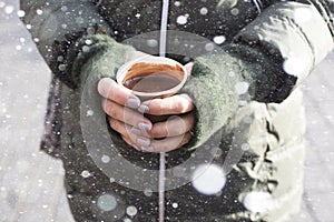 Hands holding cup of hot chocolate