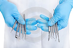 Hands holding dental instruments