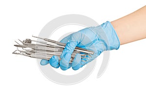 Hands holding dental instruments