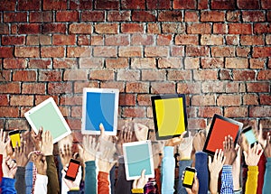 Hands Holding Digital Devices with Colourful Screens photo