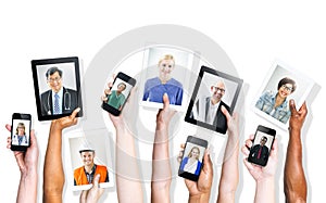 Hands Holding Digital Devices with Professional People's Images