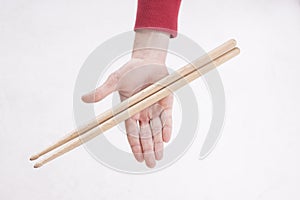 Hands holding drumsticks