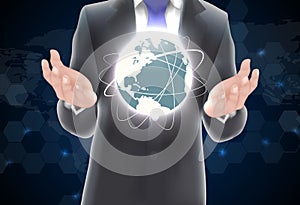 Hands holding earth of background on blue and black