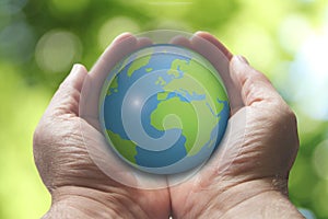 Hands holding the Earth