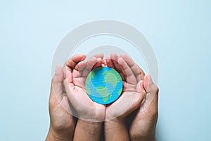 Hands holding earth, save planet, earth day concepts